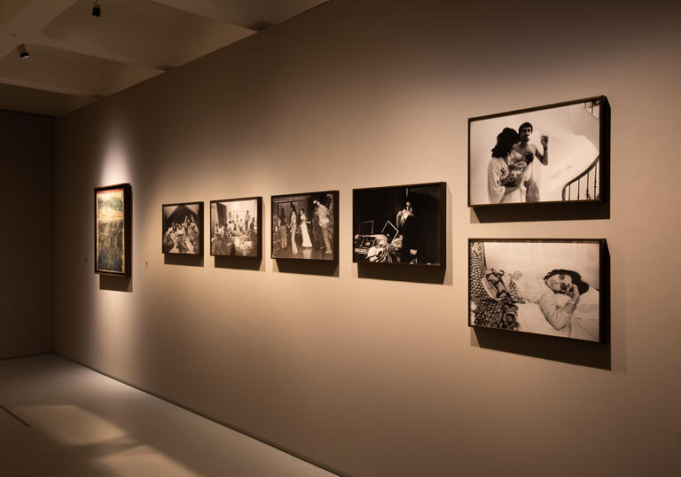 A photo of some of Pablo Bartholomew's photographs on the wall in the Barbican Art Gallery