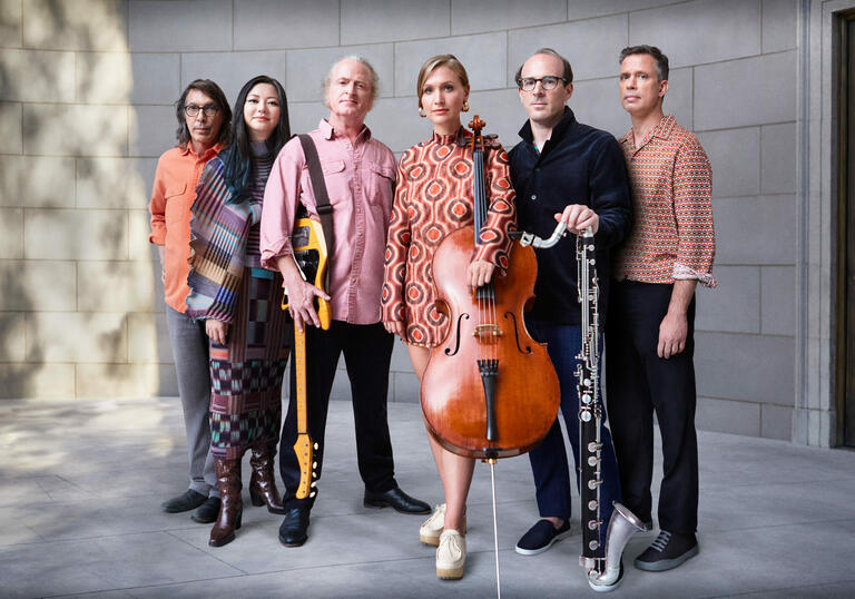 Image of the band Bang on a Can stood next to each other