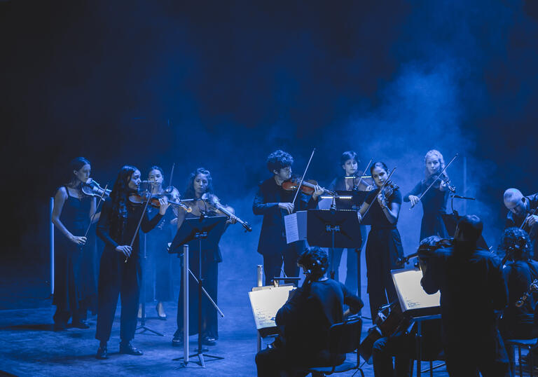 12 Ensemble performing on stage