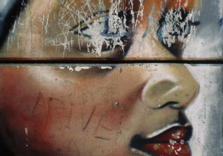 A drawing of a Black child with scratched out eyes