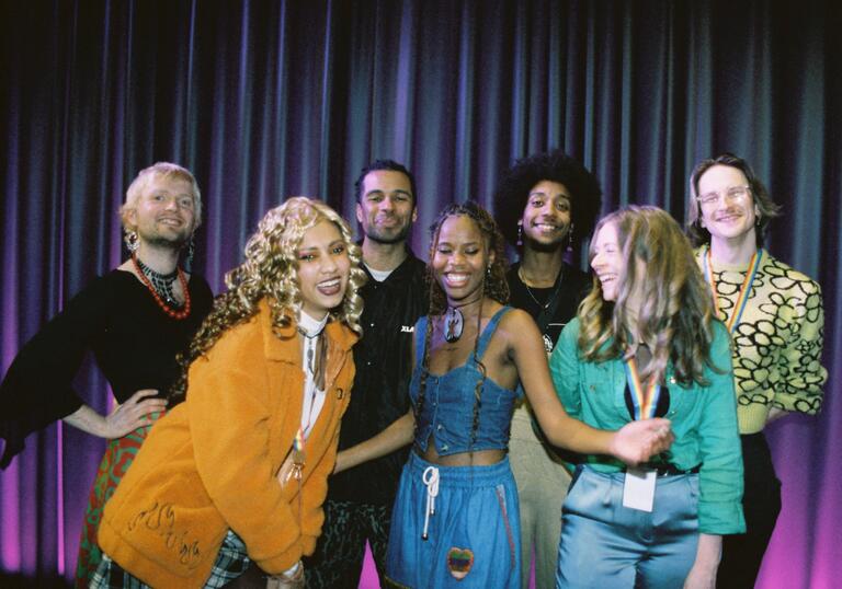 A group shot of people enjoying each other's company. 