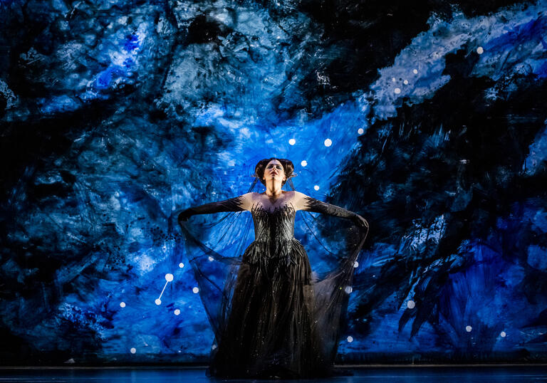 Tuuli Takala as Queen of the Night on a bright blue background