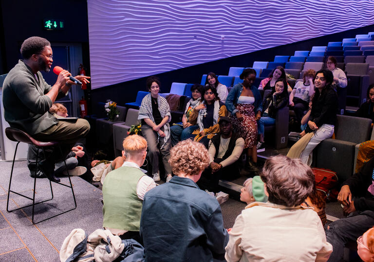 A group of people in a poetry workshop/talk