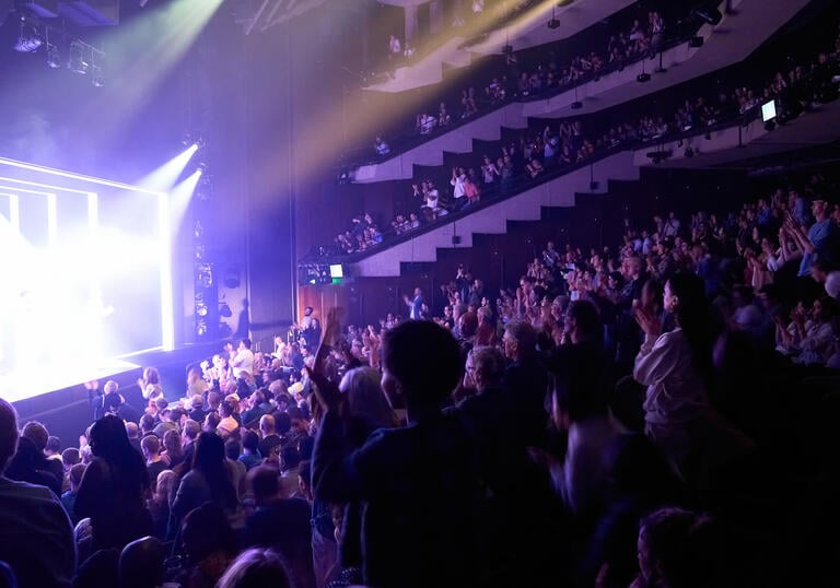 Audience applauding in the Barbican Theatre