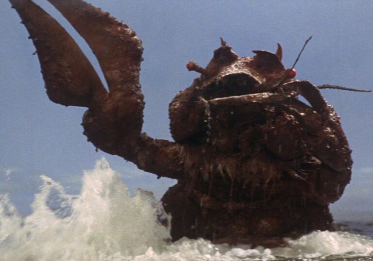 A film still showing Ebirah, the giant crustacean monster, emerging from the sea with his claw raised