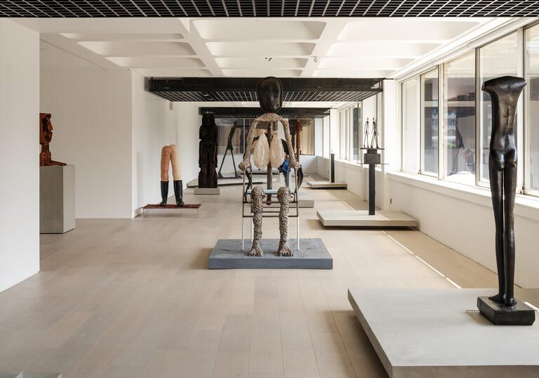 A shot of the gallery, showing sculptures by Giacometti and Huma Bhabha.