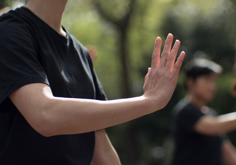 A close up of a person practicing Tai Chi