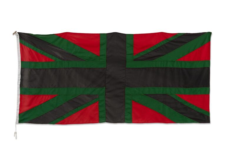 A Union Jack flag using the colours red, green and black.