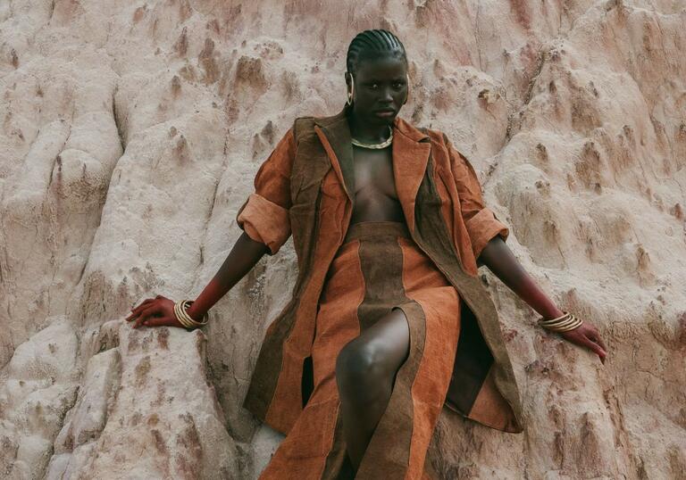 IAMISIGO, clay-dyed barkcloth dress, Shadows, Spring/Summer 2024. Photograph by Fred Odede. Courtesy of IAMISIGO. Dirty Looks at the Barbican.