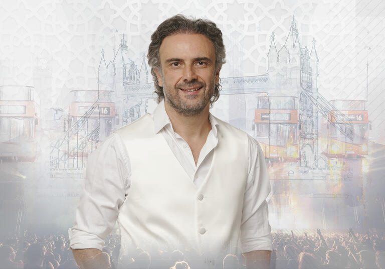 photo of Iyad Rimawi in a white shirt in front of a grey and white background