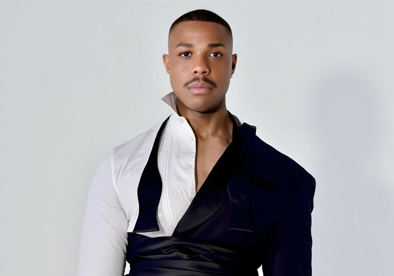 Davone Tines in an avant garde suit