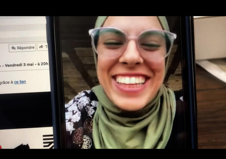 A young woman on a video call.