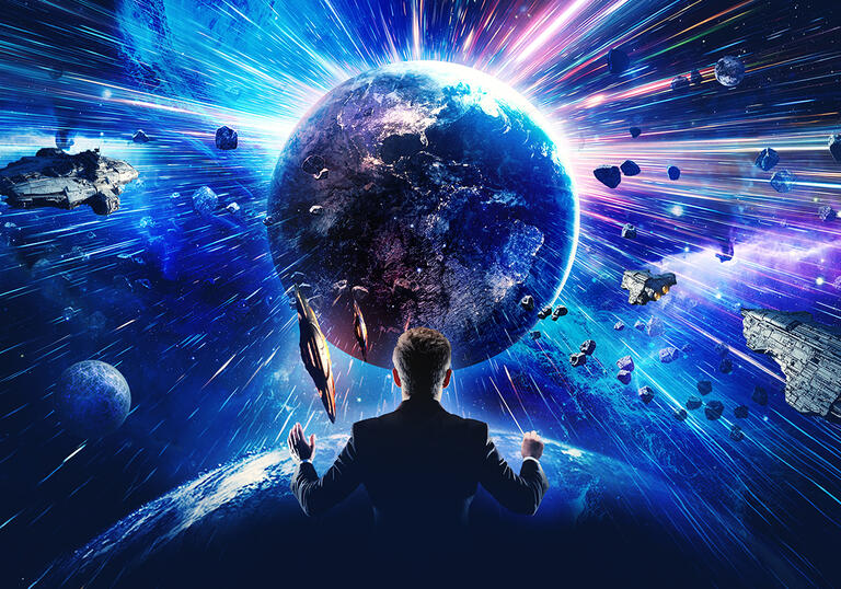 A conductor standing in front of the solar system with a blue hue 