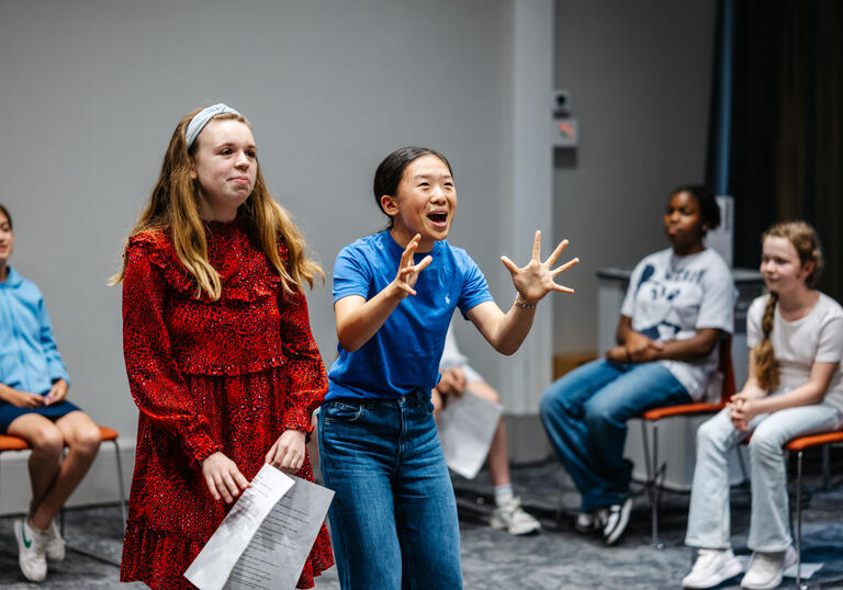 A group of young people performing in a drama workshop