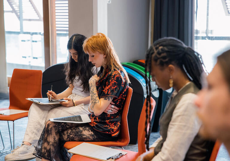 A group of young people at a writing workshop