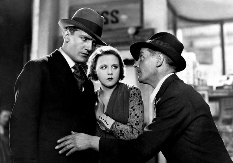 two men and a woman talking