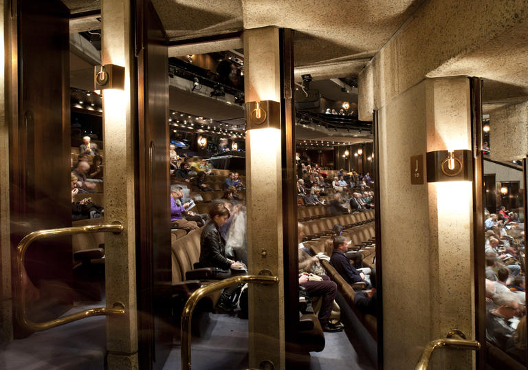 Photo through the doors of the Barbican theatre into the stalls