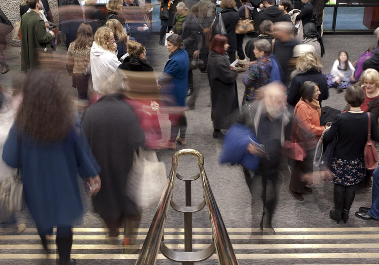 Photo of crowd of people on stairs in Barbican Foyers