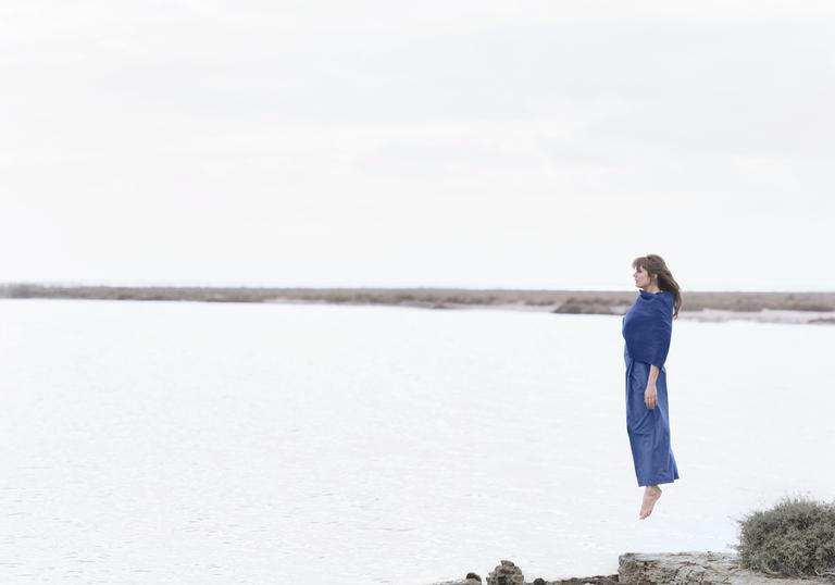 Camille floating over a lake