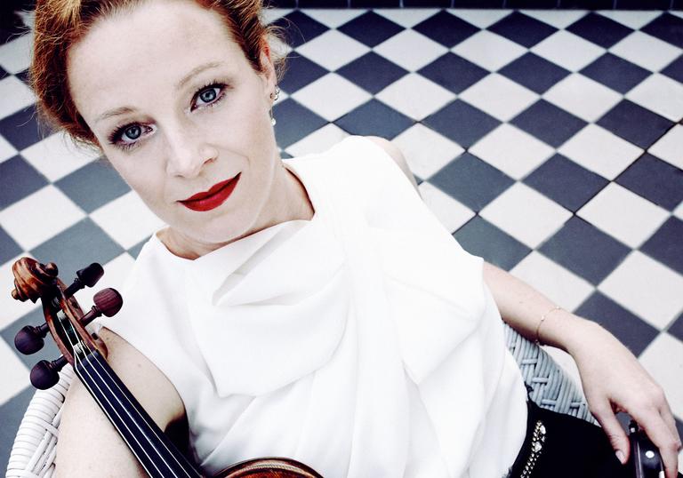 A picture of Carolin Widmann holding her violin