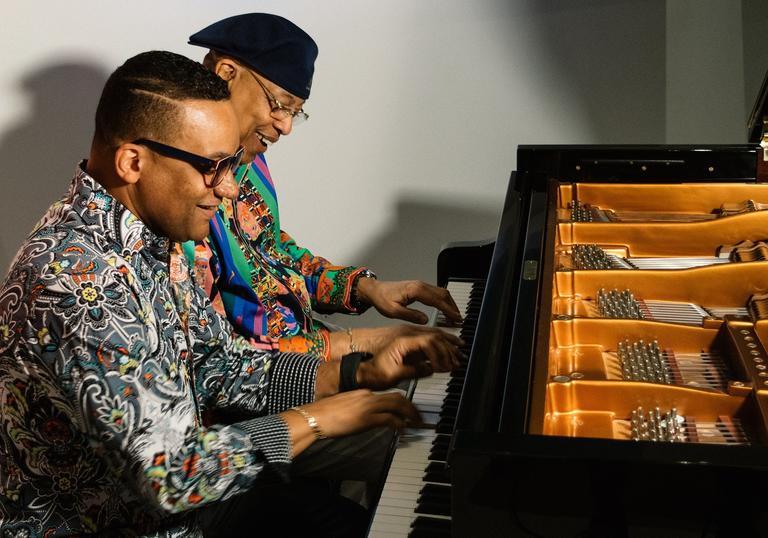 Chucho and Gonzalo playing the piano