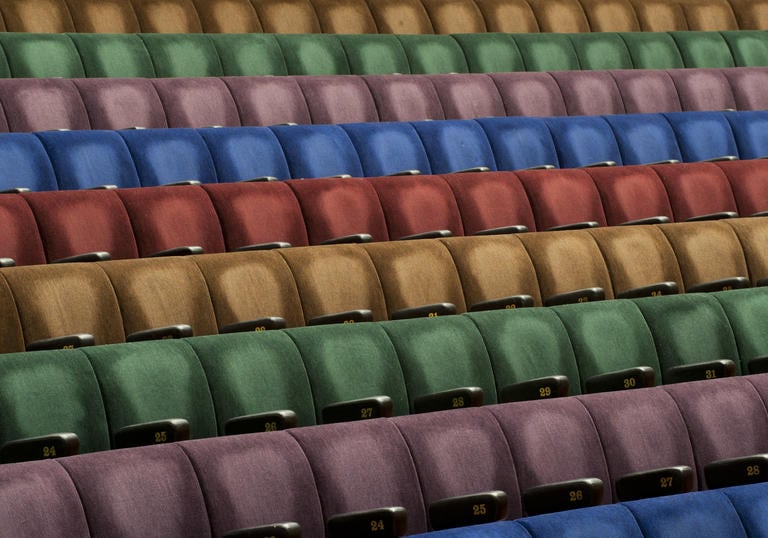 Photo of multicoloured seats in the Barbican Hall