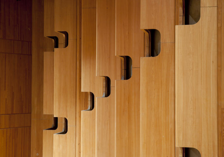 Photo of wooden paneling inside the Barbican Concert Hall