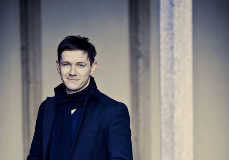 A full colour photograph of Iestyn Davies