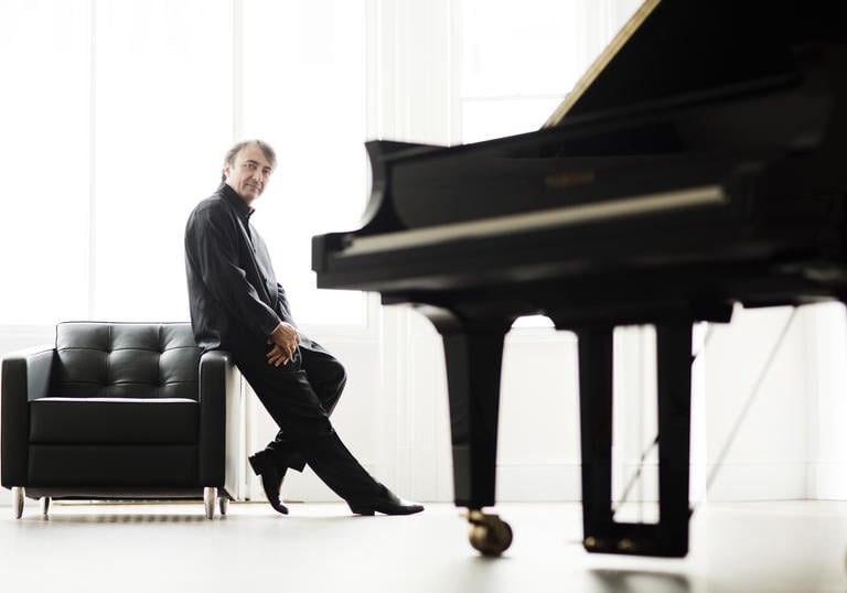 A full colour photograph of Jean-Efflam Bavouzet and piano
