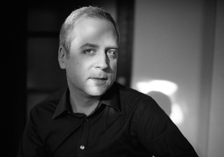 A black & white headshot of Jeremy Denk