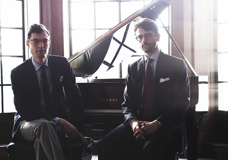 A colour photograph of Timo Andres and David Kaplan by a piano