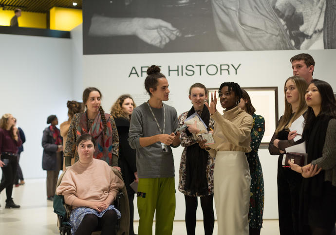 Young people look at art