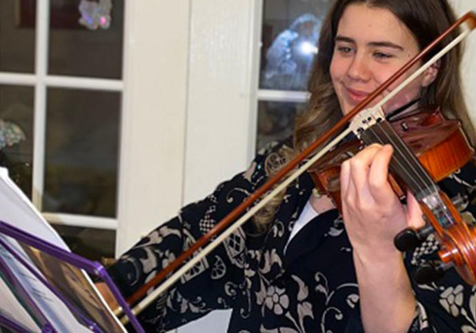 Young woman playing a violin