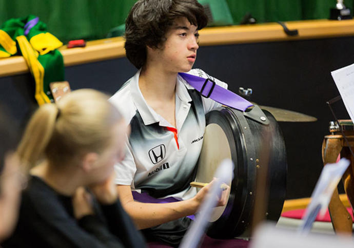 Young man playing drum