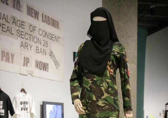 Mannequin dressed in khaki army style suit with a hijab