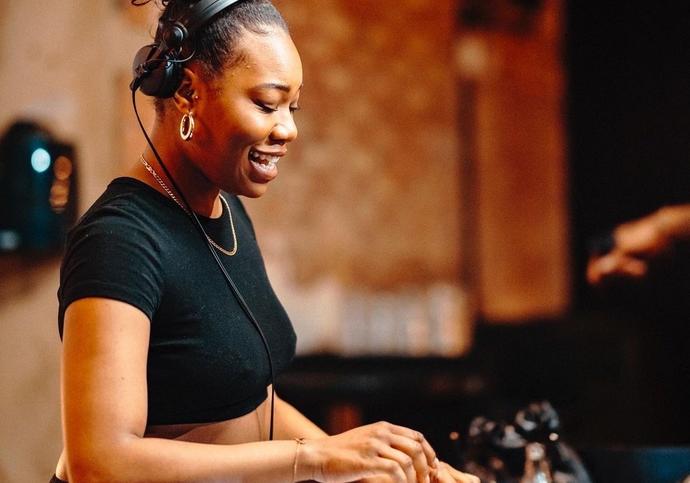 image of black female djing 