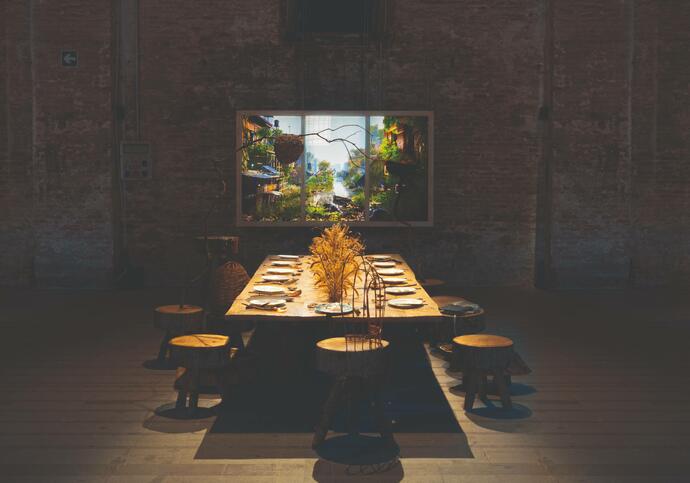 dark room with a wooden table and chairs