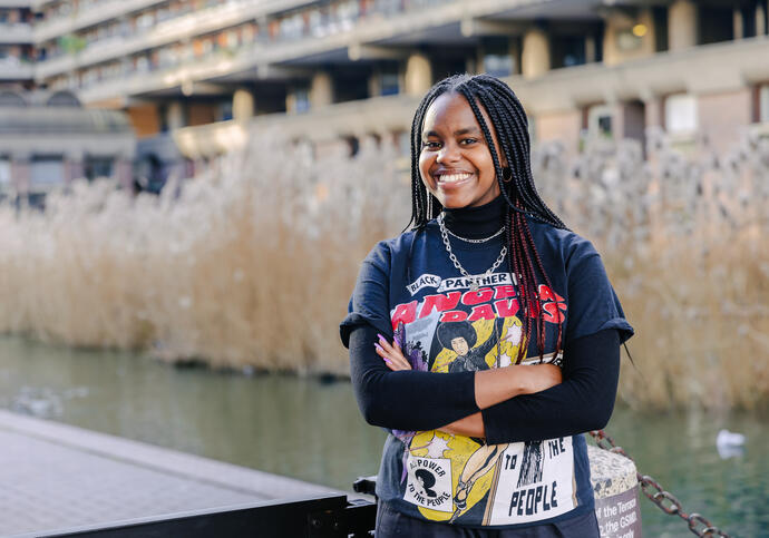 Image of Wanjiku smiling, wearing black top