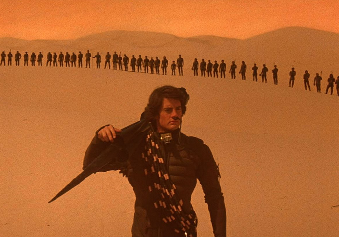 A young man in a desert leads an army.