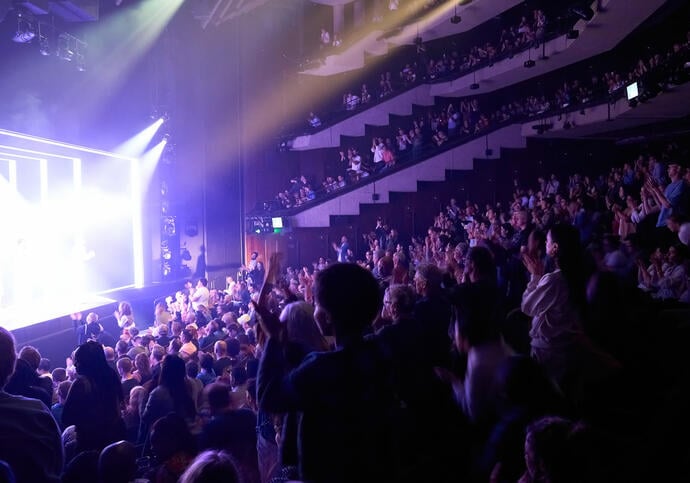 Audience applauding in the Barbican Theatre