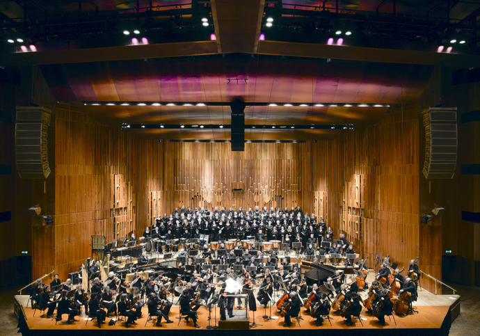 A photo of the Barbican Concert Hall with orchestra playing
