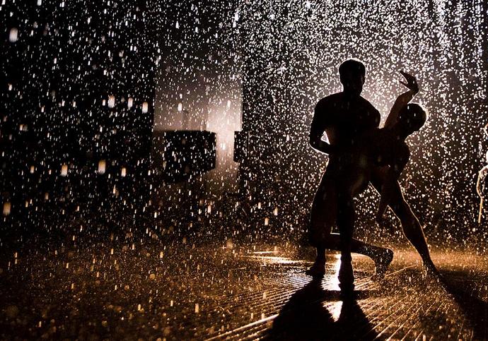 Photo of two people dancing in the Rain Room