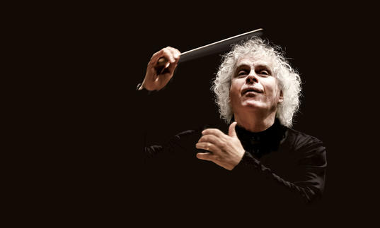 Photo of Sir Simon Rattle conducting