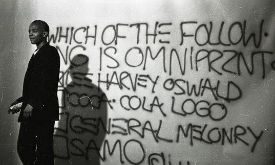 Photo of Basquiat with graffiti