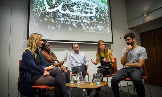 Photo of group of young people in a panel discussion