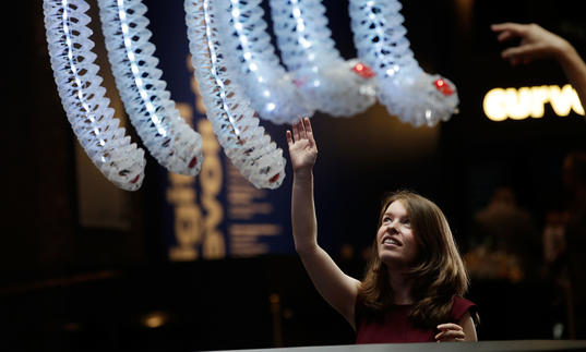 photo of a woman touching some digital tentacles