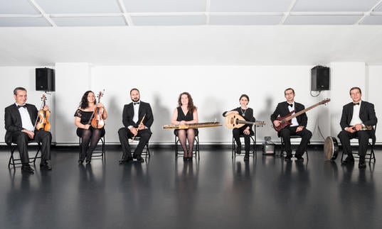 The London Syrian Ensemble sitting in a row