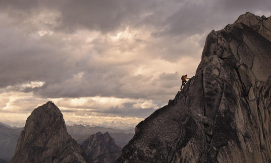 A man climbing a mountain