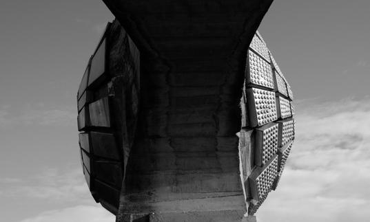 A still image from Last and First Men depicting a dilapidated building