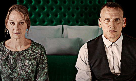 Images of a woman on the left and a man on right. Sat on the edge of a bed in formal clothes